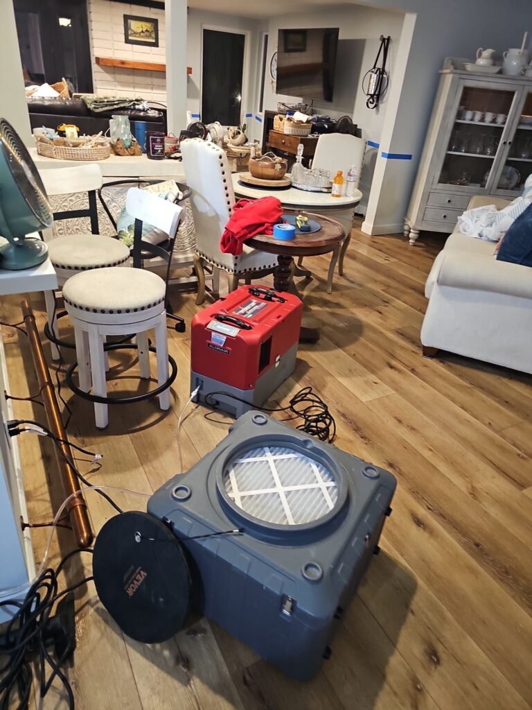 Air scrubber running in a Santa Ana living room to clear smoke odor
