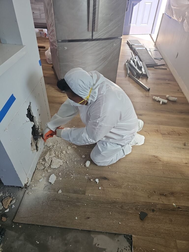 Drywall cut back to sound material during a mold removal in Santa Ana